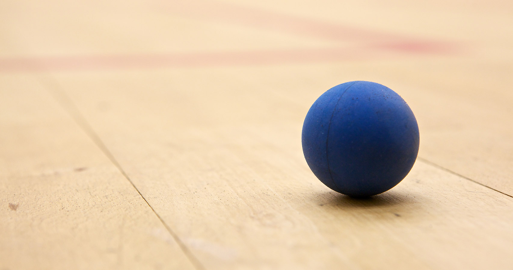 Squash ball on a court