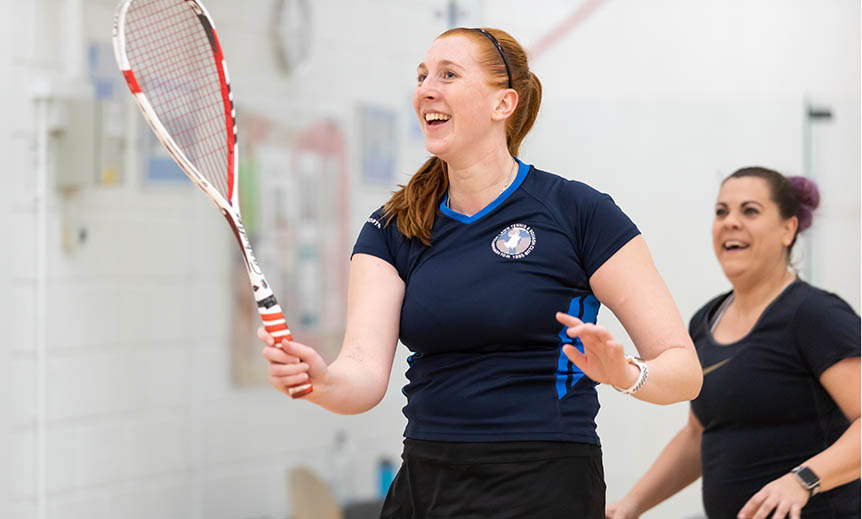 Women playing squash