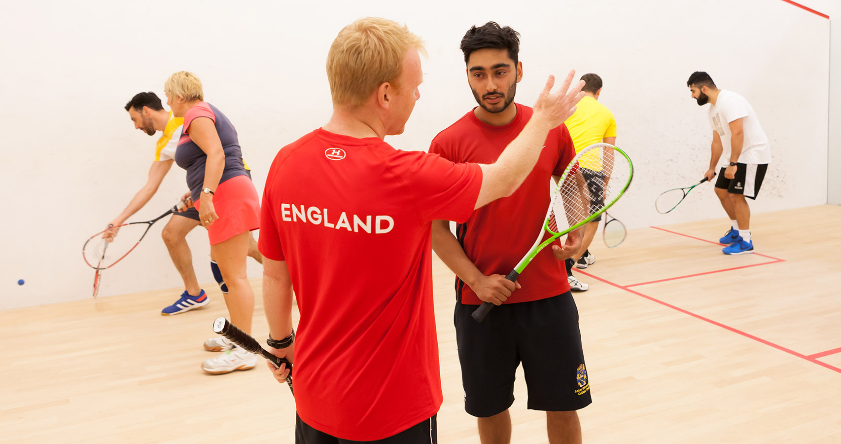 England squash coach with players