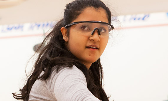 Teenager wearing protective squash eyewear